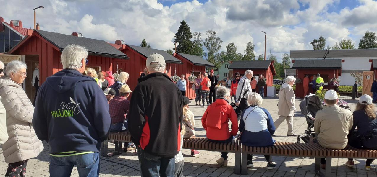 ihmisiä torilla - kuvituskuva